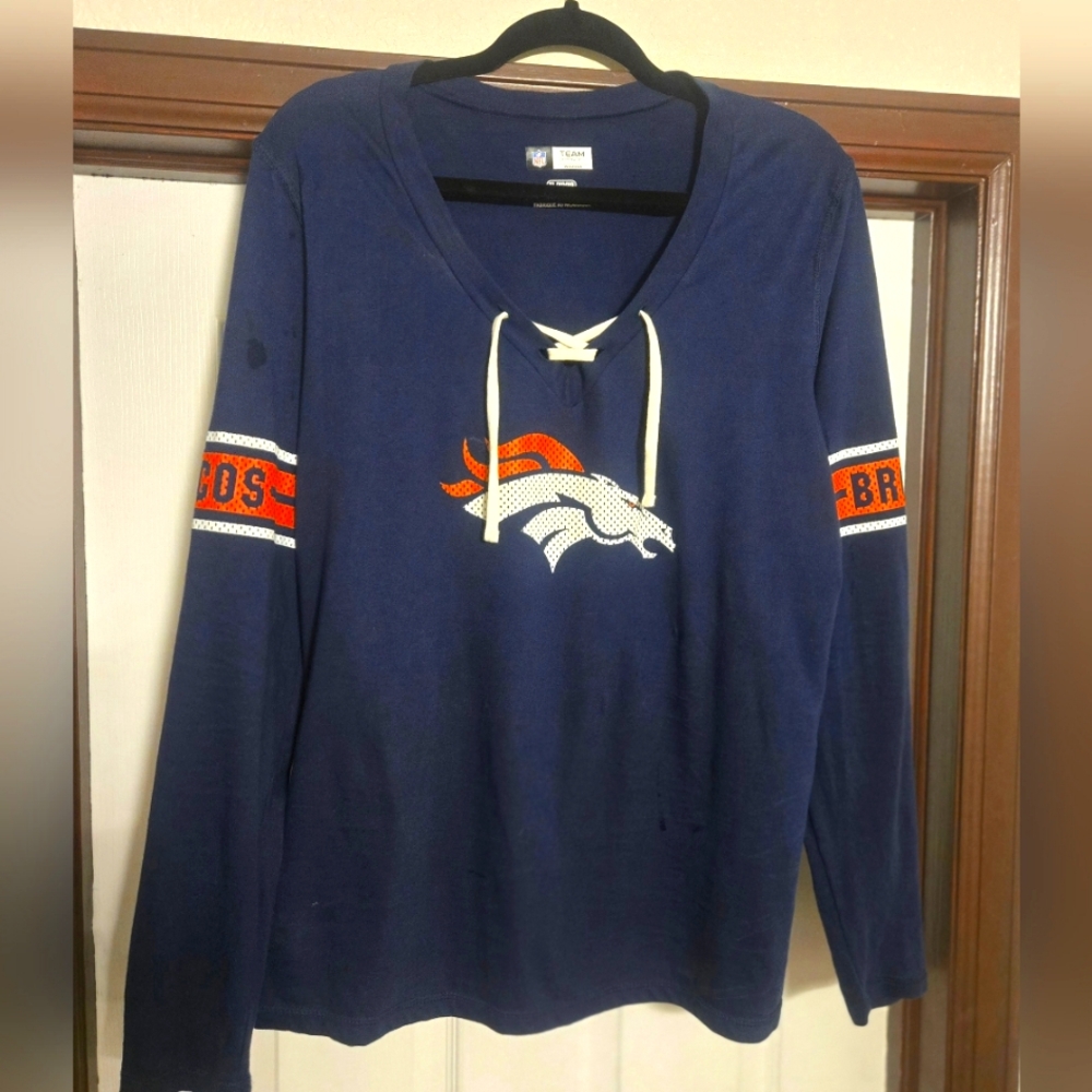 Womans Denver Broncos Official NFL team apparel -lace up shirt. Size XL